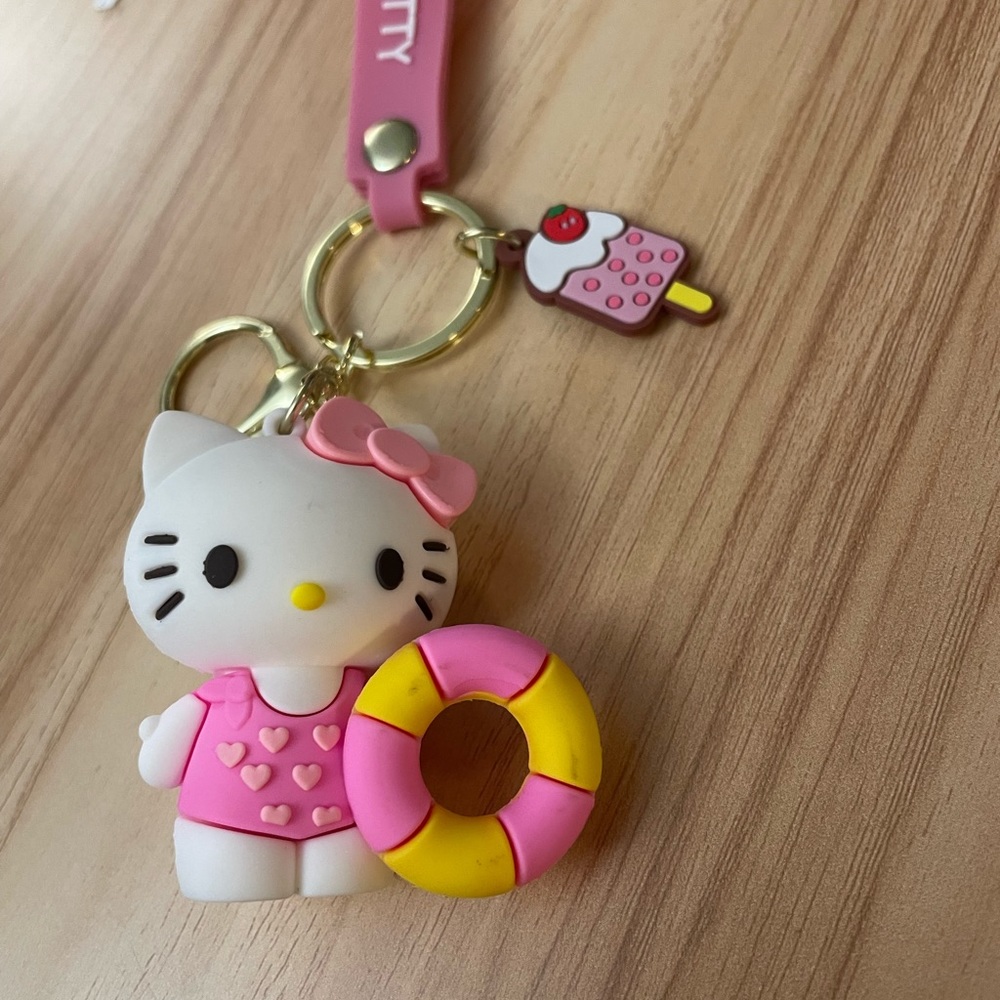 Sanrio HELLO KITTY Swimsuit Beach Summer keychain featuring a icecream charm.